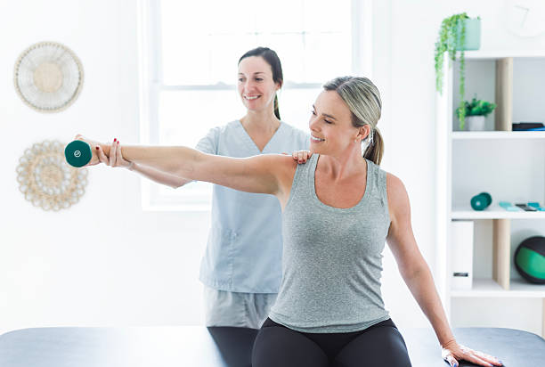 istock Modern rehabilitation physiotherapy clinic with professional and client 2244806441