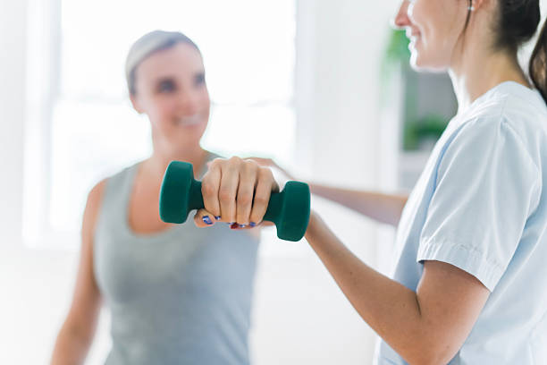 istock Modern rehabilitation physiotherapy clinic with professional and client 2244806449