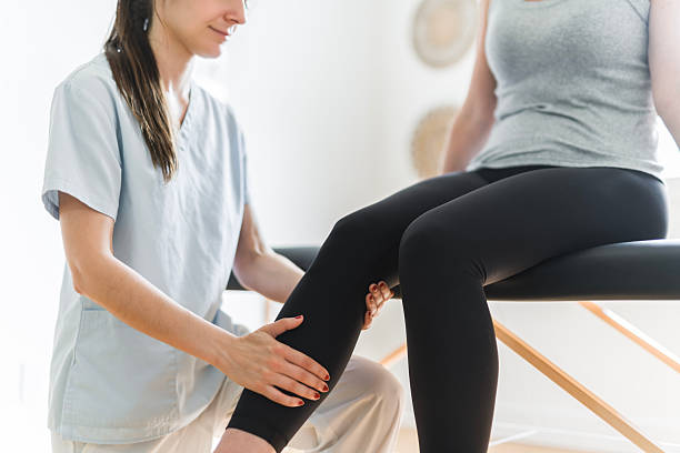 istock Modern rehabilitation physiotherapy clinic with professional and client 2244806468