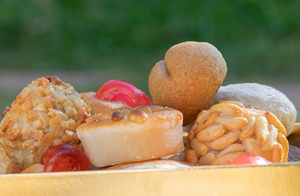 Panellets from Castanyada in Catalonia - Assorted penellets with  many forms and flavours. Potatoe with sugar and  almond, chocolate, cherry, pine nuts, coffee, even almond cream with sugar outside. Delicious!!