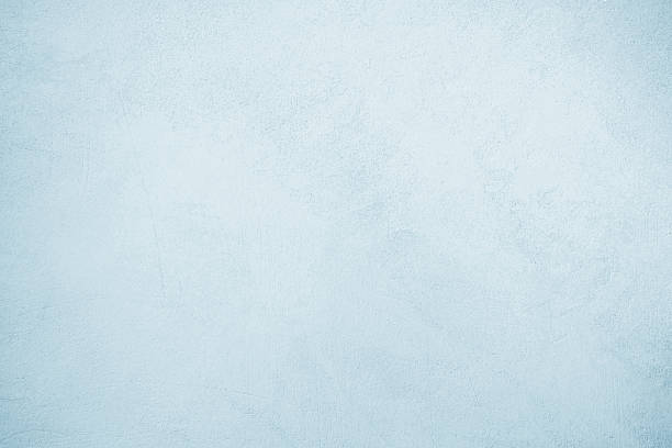 istock Light blue mint white concrete cement wall grungy surface texture background. Pale soft pastel shade. Painted plaster. Simple minimal. Blank empty template design. Christmas winter cold. 2244808989