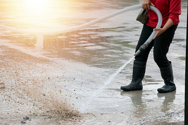 istock Workers are using water to wash the road surface. 2244809004