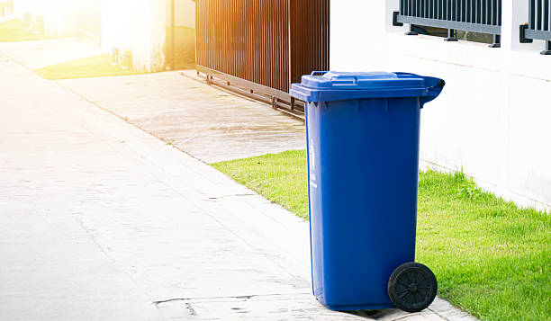istock Blue trash cans are located on the roadside. 2244809028