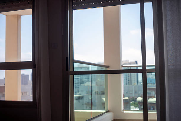 istock wide windows and a urban view 2244811427