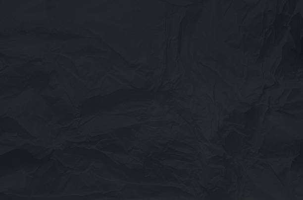 istock Surface of crumpled wrinkled black paper 2244813135