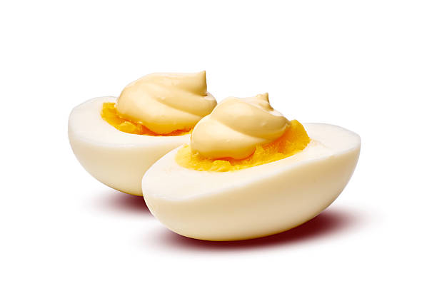 Enjoy these delicious deviled eggs featuring a creamy and tantalizing filling inside them