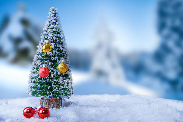 istock Mini Christmas Tree In Snow With Colorful Ornaments 2244814620