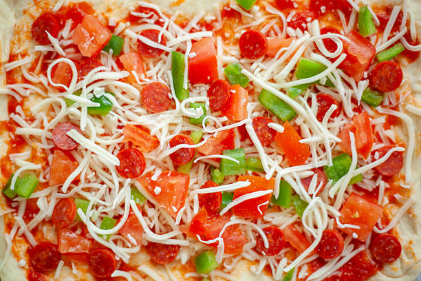 Homemade pepperoni and pepper pizza