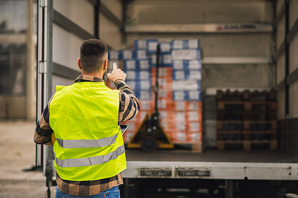istock Delivery coordinator verifying cargo at warehouse truck dock 2244815722