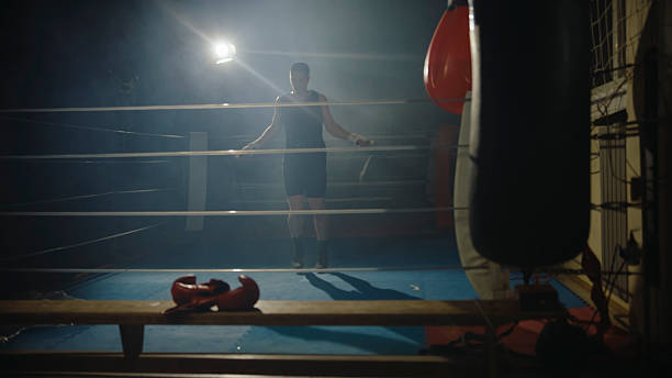 istock Focused Caucasian Athlete Using Jump Rope in Boxing Gym 2244815956