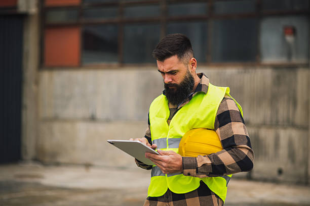 istock Logistics staff reviewing data on tablet at worksite 2244816046