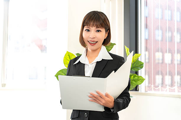 istock Woman holding a binder 2244816278