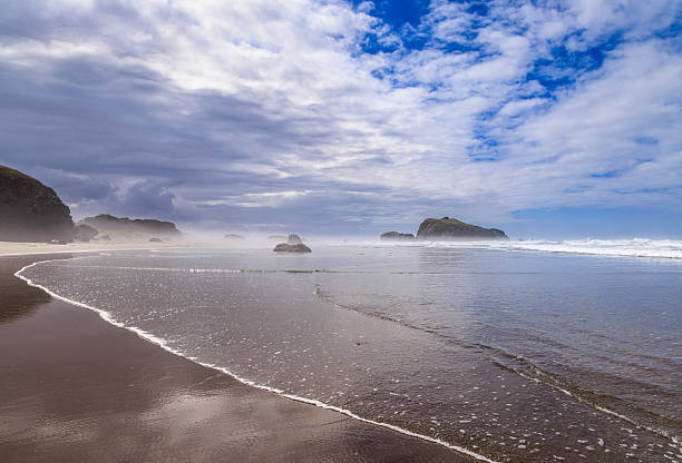 Foggy misty stormy morning over the Pacific Ocean and sea stacks at Bandon, Oregon, USA.