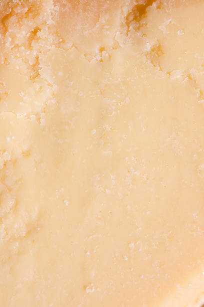istock Texture of aged parmesan cheese macro background 2244826496