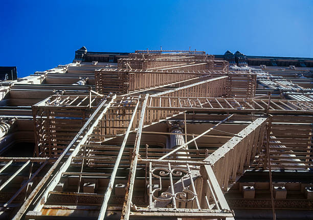Building with exterior fire escapes, typical of New York architecture