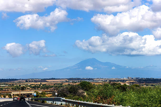Sicilian landscape with highway and volcanic mountain, Sicily, Italy