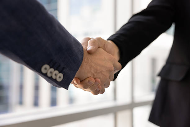 istock Cropped shot of arms in handshake gesture 2244838033