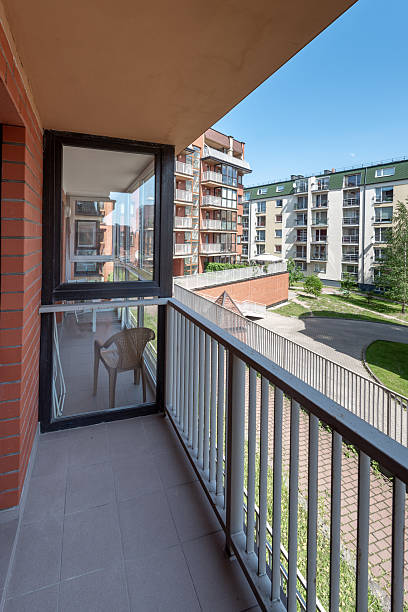 istock Modern Apartment Balcony with Brick Wall and Urban Landscape 2244841767