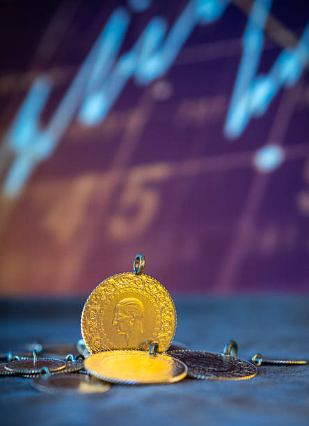 istock Gold Coins on Stock Market Chart 2244843455