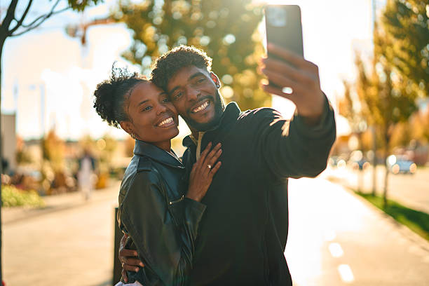 istock Happy black couple taking selfie with smartphone 2244844530