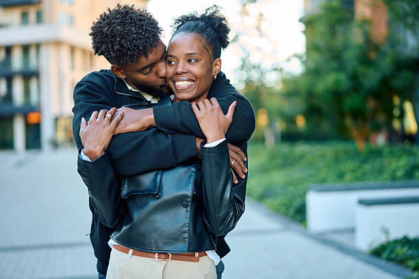 istock Happy black couple embracing outdoors showing affection 2244844720