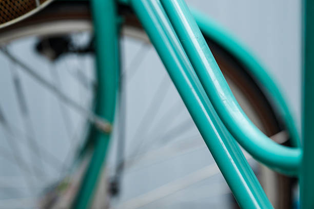 Rust detail on turquoise bicycle rear fender.
