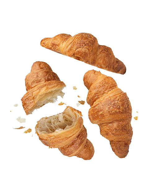 istock Croissants falling on a white isolated background, levitation 2244846891