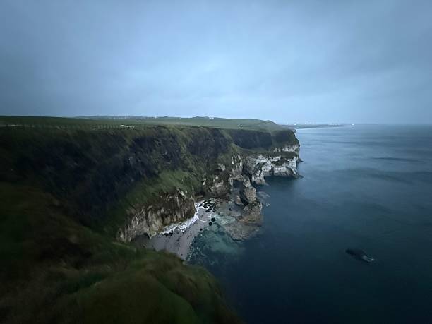 A wide and dramatic shot of the cliffs of Northern Ireland, at Magheracross Viewpoint, County Antrim, Northern Ireland