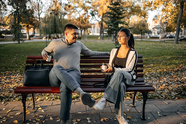 istock Two young business colleagues spending time together outside while on a break holding coffee cup in hand 2244847763