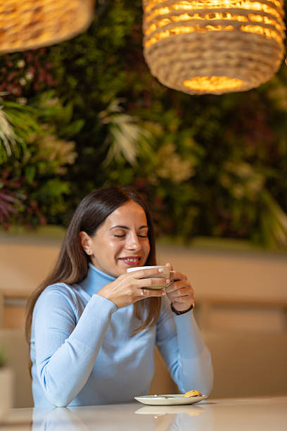 istock young beautiful woman enjoying coffee 2244849243