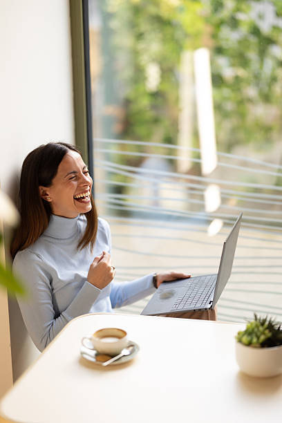 istock A young woman in a cafe has a video call. 2244849564