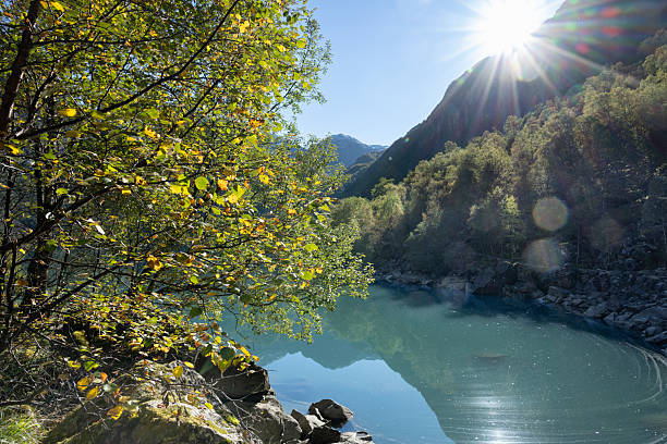 Lake Bondhus and surrounding mountains in Folgefonna National Park in the Western part of Norway in autumn (late September). Lens flare adds to the atmosphere.