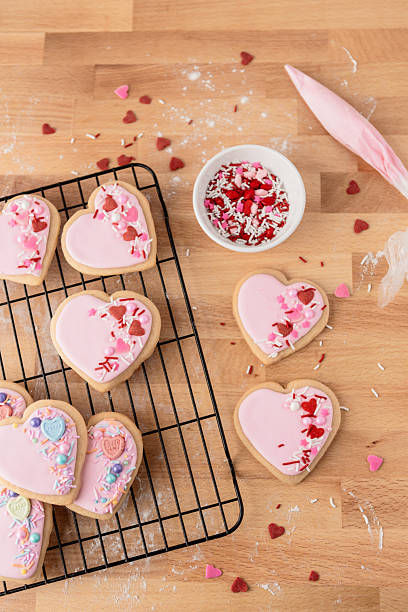 istock Heart-Shaped Sugar Cookies on a Cooling Rack with Sprinkles 2244851248