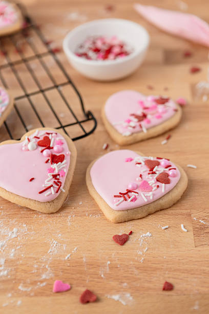 istock Heart-Shaped Sugar Cookies on a Cooling Rack with Sprinkles 2244851252