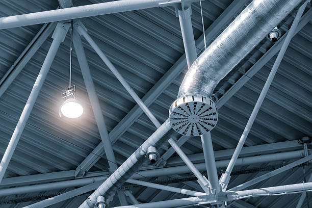 istock light is shining on a metal structure with a camera on it. The structure is a ventilation system 2244852327