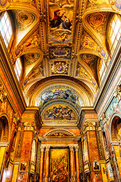 Baroque nave and altar of Santa Maria del Suffragio, Rome, Italy, with barrel‑vaulted frescoes and classical aedicule altar.