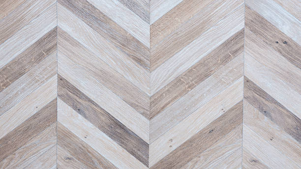 istock wooden floor with a chevron pattern. chevron pattern is made up of different wood types and is very intricate 2244854619