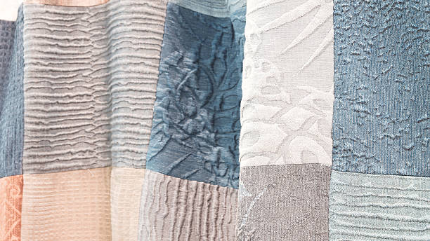 istock collection of different colored fabric pieces are displayed in a row.  colors include blue, gray, and white.  arrangement ofpieces creates a sense of texture and depth 2244854767