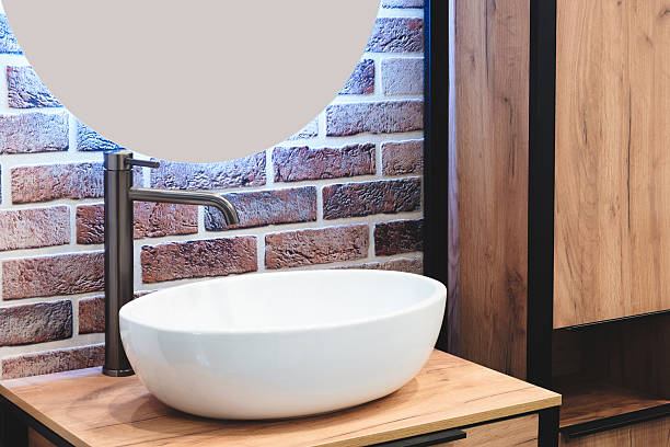 istock white sink with  brick wall behind it, modern bathroom interior 2244854915