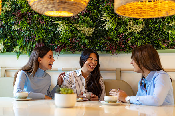 istock three young women drinking coffee and having a good time 2244855213