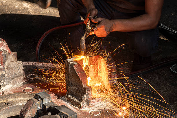 istock Hands of industrial worker using oxy-fuel torch to cut metal. 2244858553