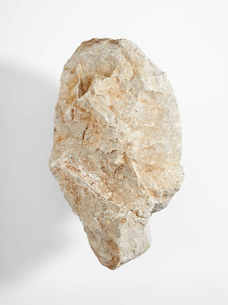 istock A large limestone rock on a white background. Close-up v1 2244859517