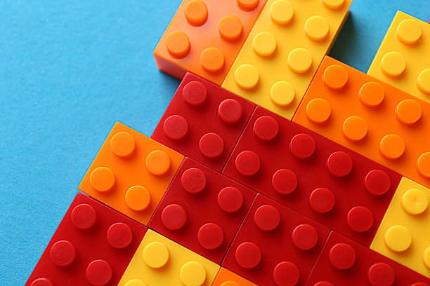 istock Constructor toy. Many colorful building blocks on light blue background, top view 2244863300