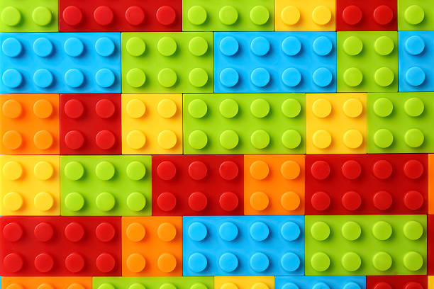 Constructor toy. Many colorful building blocks as background, top view