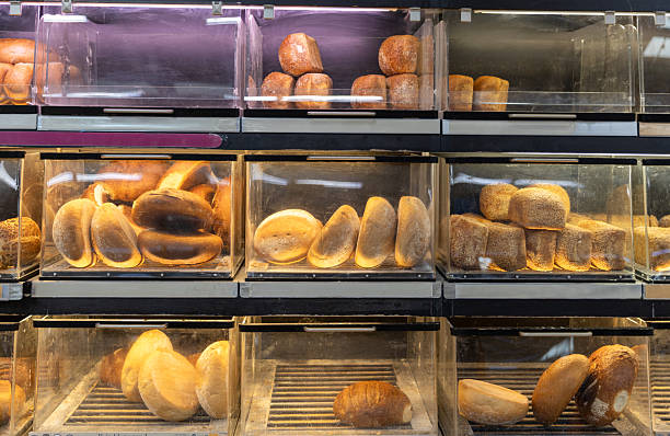 istock Assorted breads in boxes on the counter in the store. 2244865674