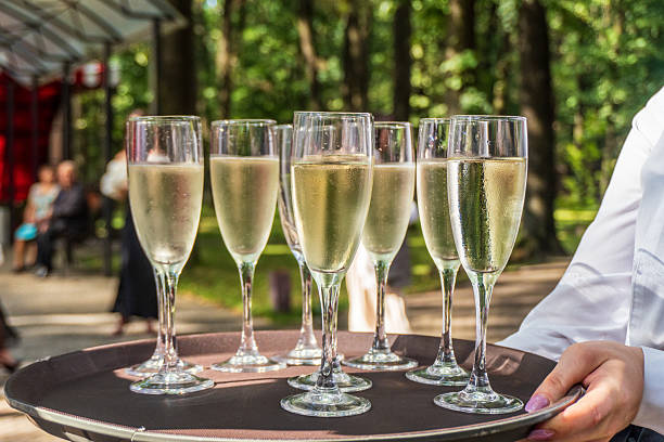 istock Celebratory drinks served on a tray during outdoor gathering in sunny park surrounded by trees 2244866711