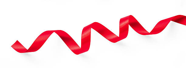 istock Red satin bow ribbon scroll isolated on white background with clipping path for Christmas holiday and wedding anniversary card confetti design decoration 2244868235