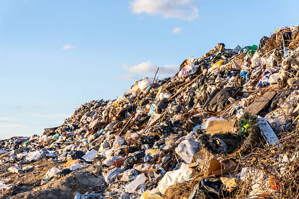 istock Garbage pile reflecting environmental challenges in an open area under a clear blue sky 2244869491
