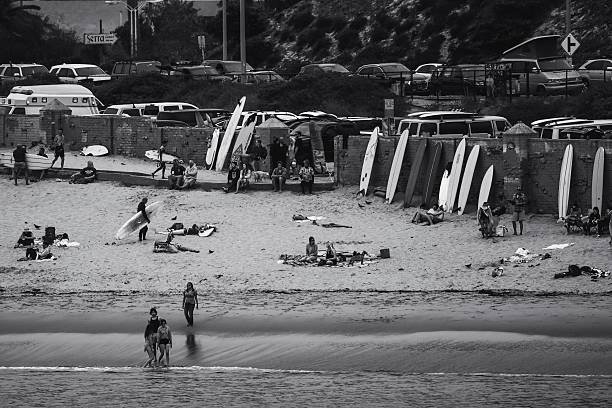 Malibu, California - September  26, 2021 - Image capturing candid, high-energy surfing action in dynamic coastal settings, highlighting surf culture, and the vibrant energy of the beach lifestyle.