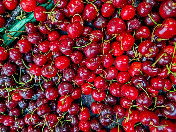 istock Ripe red cherries with stems. 2244872662